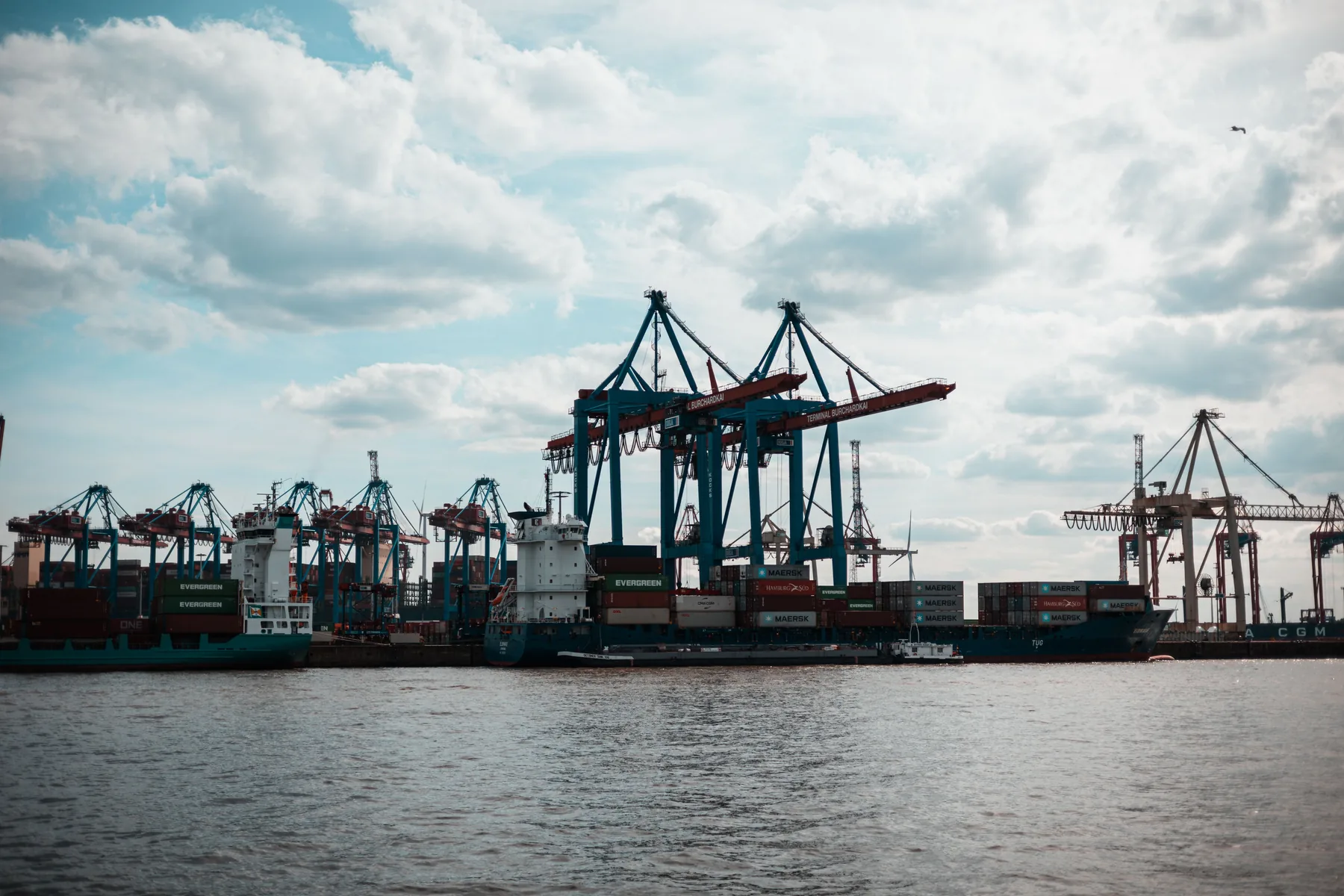Container terminal under a cloud-filled sky