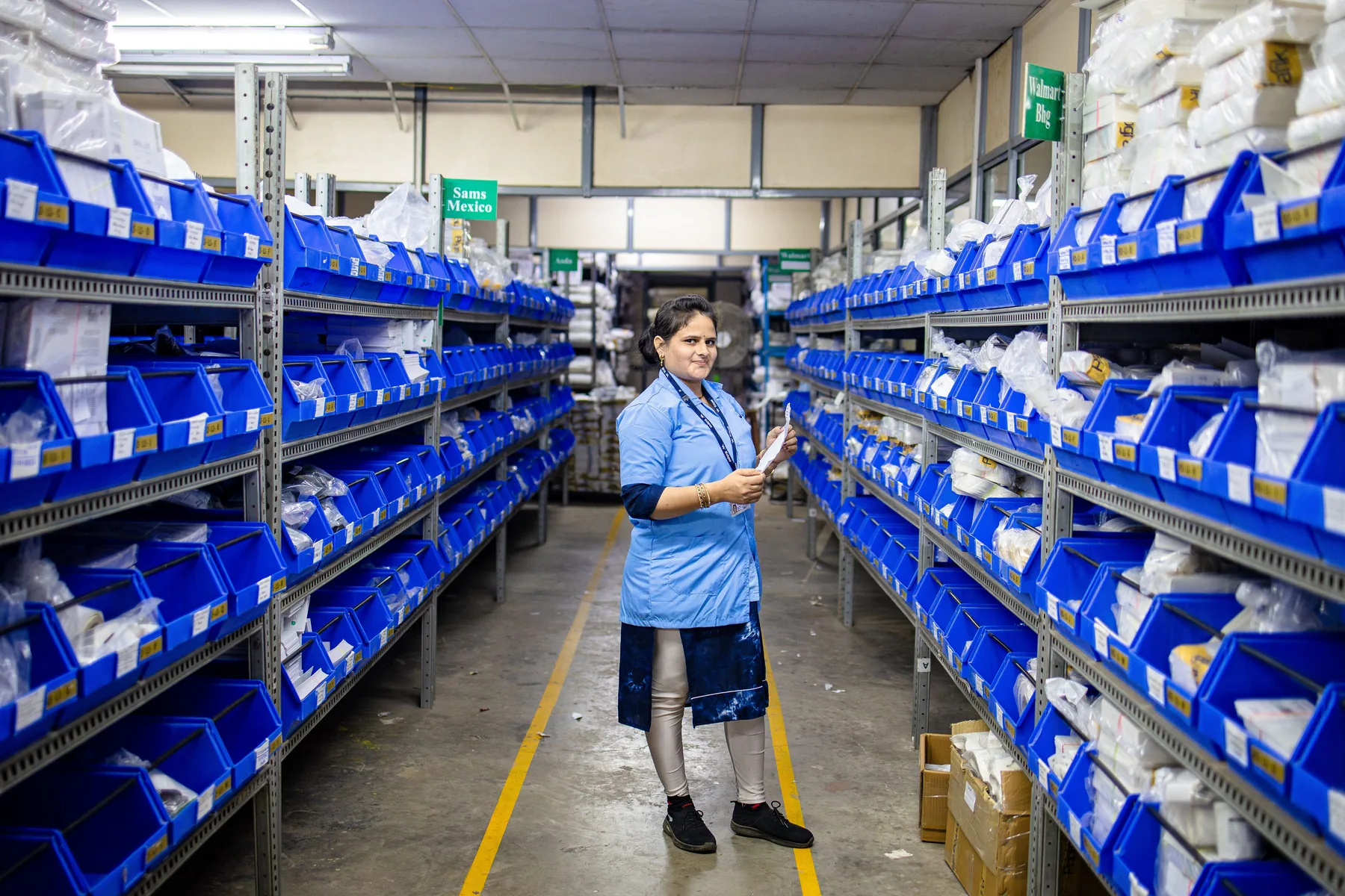 Warehouse professional reviewing inventory in a storage aisle